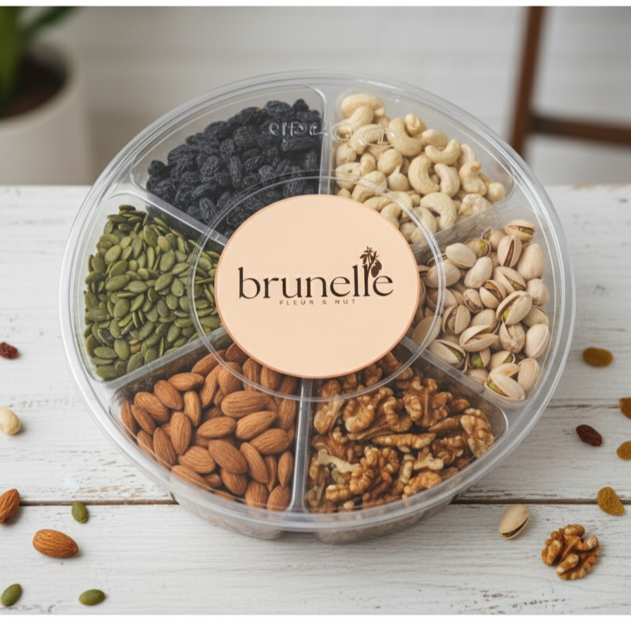 Nuts in a transparent container with 'brunelle' branding on a wooden surface.